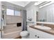 Clean bathroom featuring a vanity, and shower-tub combination that offers a functional and comfortable space at 8144 Sw 108Th Street Rd, Ocala, FL 34481