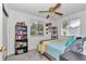 Inviting bedroom with a comfortable bed, and a large window for natural light; perfect for relaxation and rest at 8144 Sw 108Th Street Rd, Ocala, FL 34481
