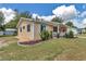 Charming single-story home featuring a well-manicured lawn and inviting front porch at 8144 Sw 108Th Street Rd, Ocala, FL 34481