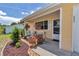 Charming front porch with vibrant flower arrangements and a welcoming entrance to this lovely home at 8144 Sw 108Th Street Rd, Ocala, FL 34481