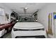 Well-lit garage featuring a car, organized storage, and easy access at 8144 Sw 108Th Street Rd, Ocala, FL 34481