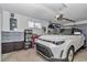 Well-organized garage space with storage, a car, and overhead lighting for a functional and tidy area at 8144 Sw 108Th Street Rd, Ocala, FL 34481