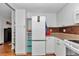 Bright kitchen with white cabinets, modern refrigerator, and stylish backsplash at 8144 Sw 108Th Street Rd, Ocala, FL 34481