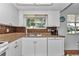 Functional kitchen featuring stainless steel sink, white cabinets, and modern appliances at 8144 Sw 108Th Street Rd, Ocala, FL 34481