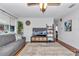 Bright and airy living room boasts a large window, comfortable seating, and stylish decor for a welcoming atmosphere at 8144 Sw 108Th Street Rd, Ocala, FL 34481
