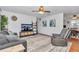 Spacious living room with comfortable seating, a modern TV setup, and stylish decor creates a relaxing atmosphere at 8144 Sw 108Th Street Rd, Ocala, FL 34481