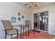 Cozy covered patio featuring comfortable seating, decorative wall art, and a seamless indoor-outdoor flow at 8144 Sw 108Th Street Rd, Ocala, FL 34481