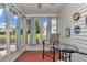 Relaxing sunroom with cozy seating and lots of natural light offers views of the property's beautiful outdoor space at 8144 Sw 108Th Street Rd, Ocala, FL 34481