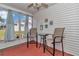Cozy sunroom with a table and chairs, perfect for enjoying a morning coffee or reading a book at 8144 Sw 108Th Street Rd, Ocala, FL 34481
