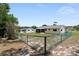 A fenced backyard with a screened in porch and exterior view of the home at 8247 Sw 105Th Pl, Ocala, FL 34481