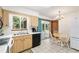 Eat-in kitchen featuring wood cabinets, backyard access, and updated appliances at 8247 Sw 105Th Pl, Ocala, FL 34481
