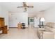 Inviting living area featuring tile flooring, ceiling fan, and natural light at 8247 Sw 105Th Pl, Ocala, FL 34481
