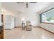 Comfortable living area features tile floors, a ceiling fan, and ample natural light, creating a welcoming space at 8247 Sw 105Th Pl, Ocala, FL 34481
