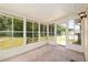 A sunroom with many windows lets in natural light and offers relaxing view of the backyard at 8247 Sw 105Th Pl, Ocala, FL 34481