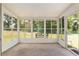 A sunroom with lots of windows and a bench perfect for relaxing and enjoying the view at 8247 Sw 105Th Pl, Ocala, FL 34481