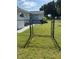 A spacious backyard with a well maintained chain link fence and grassy area at 8320 Sw 108Th Place Rd, Ocala, FL 34481