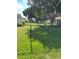 View of backyard featuring chain link fence and beautiful green lawn at 8320 Sw 108Th Place Rd, Ocala, FL 34481