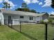 Fenced backyard with view of house and outdoor patio at 8320 Sw 108Th Place Rd, Ocala, FL 34481