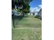 View of backyard featuring chain link fence and beautiful green lawn at 8320 Sw 108Th Place Rd, Ocala, FL 34481