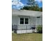 Charming backyard with a small patio and well-maintained lawn at 8320 Sw 108Th Place Rd, Ocala, FL 34481