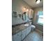 Bathroom showcasing a granite countertop and white cabinets at 8320 Sw 108Th Place Rd, Ocala, FL 34481