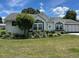 Charming single-story home with well-manicured lawn and mature landscaping at 8320 Sw 108Th Place Rd, Ocala, FL 34481