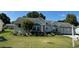 Charming home exterior with meticulous landscaping, driveway and attached garage at 8320 Sw 108Th Place Rd, Ocala, FL 34481