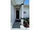 Inviting entryway with a decorative light fixture and elegant door design at 8320 Sw 108Th Place Rd, Ocala, FL 34481