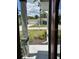 View from the front door showcasing the neighborhood and well-maintained landscaping at 8320 Sw 108Th Place Rd, Ocala, FL 34481