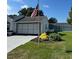 Exterior view of home with a meticulously maintained front yard and driveway at 8320 Sw 108Th Place Rd, Ocala, FL 34481