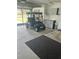 Clean and organized garage featuring a golf cart and ample storage at 8320 Sw 108Th Place Rd, Ocala, FL 34481