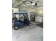 Well-maintained garage with a golf cart and convenient laundry area at 8320 Sw 108Th Place Rd, Ocala, FL 34481