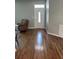 Spacious living area featuring gleaming hardwood floors and a welcoming atmosphere at 8320 Sw 108Th Place Rd, Ocala, FL 34481