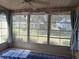 Relaxing patio features large windows, neutral decor, and a comfortable indoor/outdoor feel at 8320 Sw 108Th Place Rd, Ocala, FL 34481