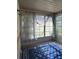 Charming patio with large windows and a calming blue rug at 8320 Sw 108Th Place Rd, Ocala, FL 34481