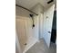 Bathroom shower area with a neutral tile floor and updated fixtures at 8320 Sw 108Th Place Rd, Ocala, FL 34481