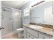 Bathroom features shower, commode and granite vanity at 8400 Sw 90Th St # C, Ocala, FL 34481