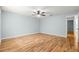 Large bedroom features ceiling fan, laminate floors, and ensuite bath at 8400 Sw 90Th St # C, Ocala, FL 34481