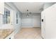 Bright breakfast nook featuring tile floors, modern lighting, and a door leading to the outside at 8400 Sw 90Th St # C, Ocala, FL 34481