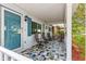 Inviting front porch with unique tile flooring and ample seating, perfect for relaxing at 8400 Sw 90Th St # C, Ocala, FL 34481