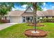 Charming single-story home featuring a garage, a well-manicured lawn, and a welcoming front porch at 8400 Sw 90Th St # C, Ocala, FL 34481