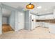 Bright kitchen features white appliances, tile flooring, and a convenient layout for easy meal preparation at 8400 Sw 90Th St # C, Ocala, FL 34481