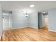 Open living room with hardwood floors and a neutral color palette creating a warm and welcoming atmosphere at 8400 Sw 90Th St # C, Ocala, FL 34481
