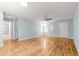 Open living area with hardwood floors, neutral paint, and convenient access to bedrooms and bathroom at 8400 Sw 90Th St # C, Ocala, FL 34481