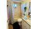 Cozy bathroom featuring a shower-tub combo, neutral tile, and a granite-topped vanity at 8547 Sw 106Th Pl, Ocala, FL 34481