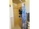 Full bathroom features tiled shower with patterned curtain and towel rack at 8547 Sw 106Th Pl, Ocala, FL 34481