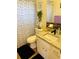 Bathroom features a single sink vanity with granite countertop, decorative shower curtain, and toilet at 8547 Sw 106Th Pl, Ocala, FL 34481