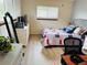 Cozy bedroom with a comfortable bed, natural light, and a dresser, perfect for relaxation at 8547 Sw 106Th Pl, Ocala, FL 34481