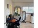 Cozy bedroom featuring a desk area and windows with natural light at 8547 Sw 106Th Pl, Ocala, FL 34481