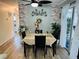 Charming dining room with brick accent wall and sliding glass doors, perfect for Gathering meals at 8547 Sw 106Th Pl, Ocala, FL 34481